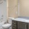 a bathroom with a tub sink and toilet