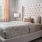 a bed with a white bed spread