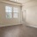 a room with a wood floor and a ceiling fan