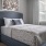 a bed with a large headboard