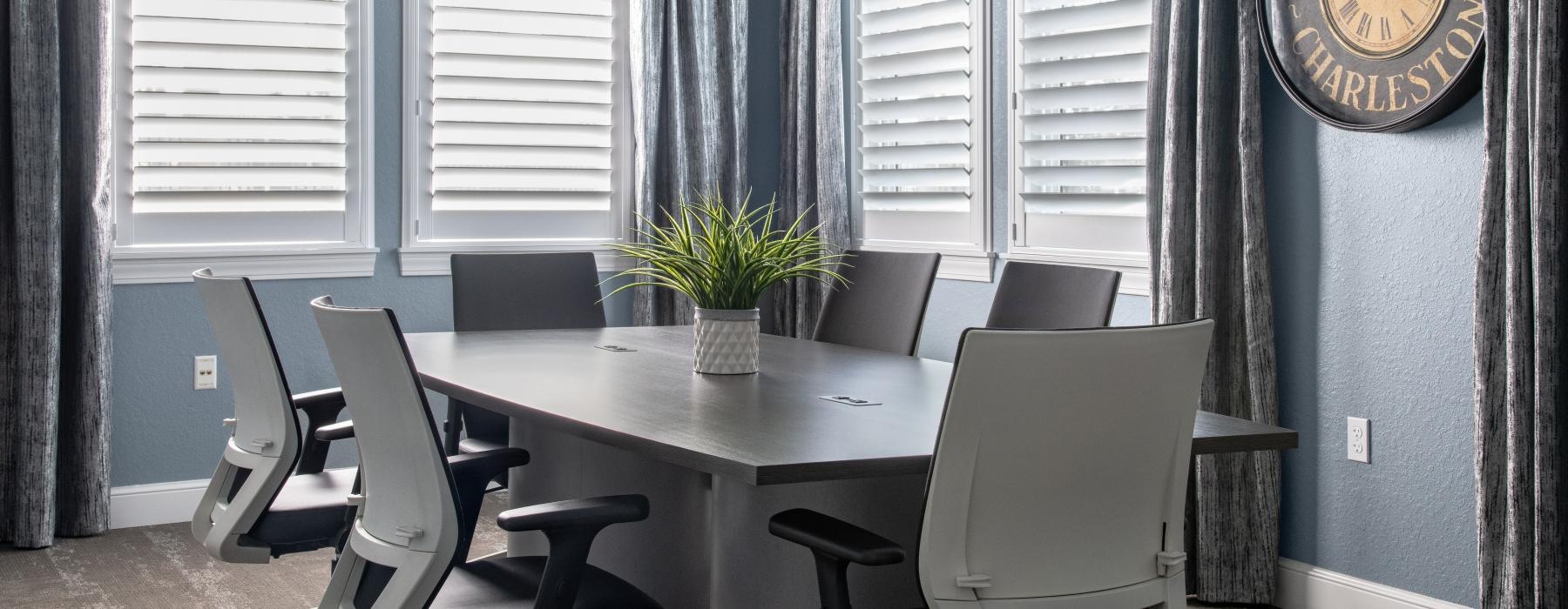 a table with chairs and a clock